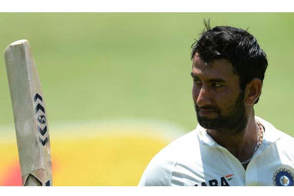 Pujara keeps his father, home crowd waiting to score test ton