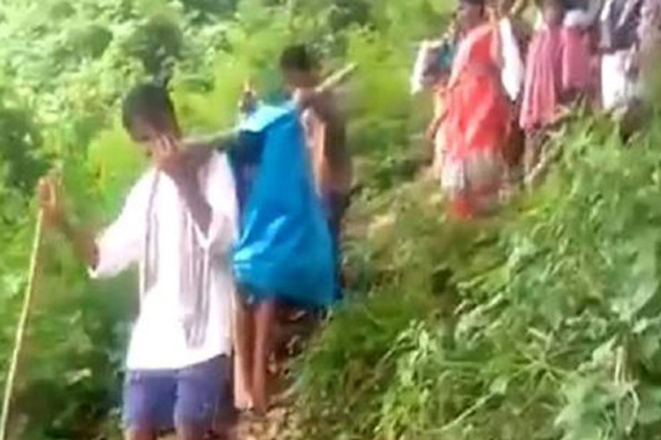 A heavily pregnant woman had to be carried for 12km in a hand-made basket