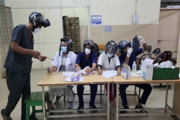 Junior doctors at Hyderabad’s Osmania Hospital wear helmets